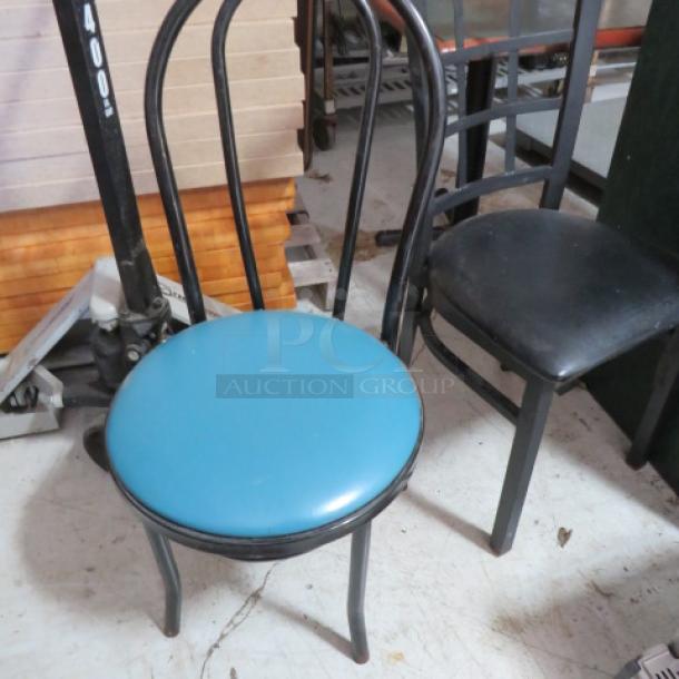 Black metal frame chair with blue upholstered seat, in good condition. Bentwood design, suitable for dining or café use.