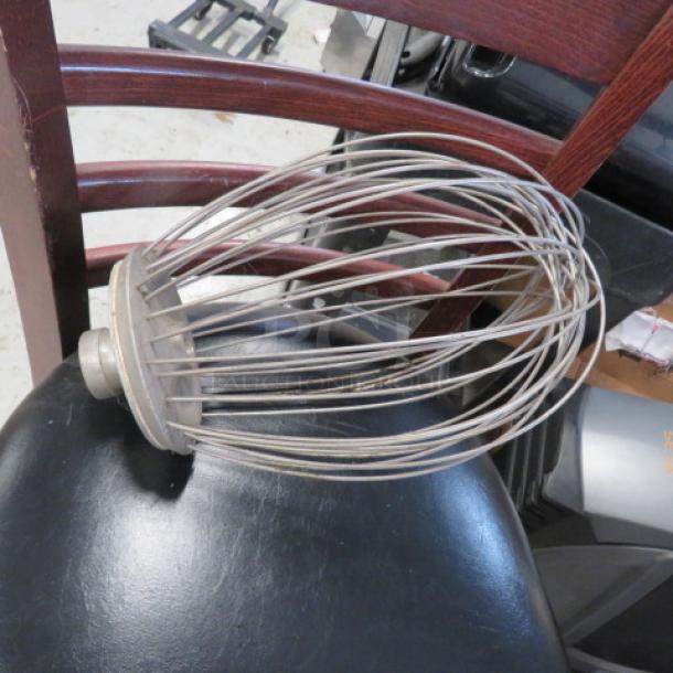 Large stainless steel wire whisk attachment, industrial size, slightly worn, designed for commercial mixers.