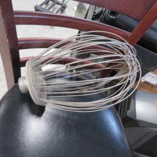 Large stainless steel wire whisk attachment, industrial size, slightly worn, designed for commercial mixers.