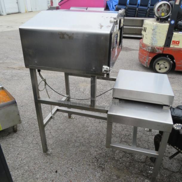 Commercial stainless steel meat slicing machine, used condition, with visible wear. Labeled controls, sturdy frame.