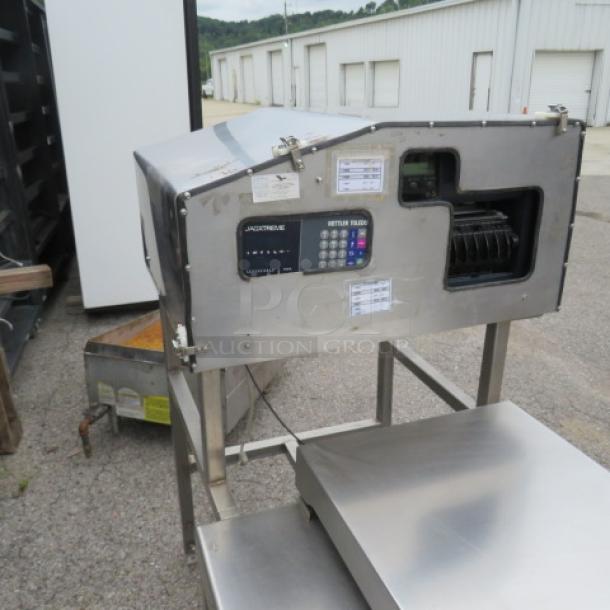 Stainless steel weighing scale with digital display, featuring a Bizerba label, in used condition with visible wear.