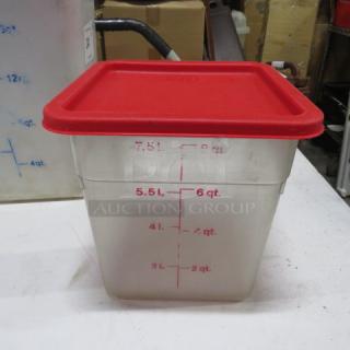 Clear plastic storage container with red lid, marked with measurements up to 6 quarts/5.5 liters. Used condition.