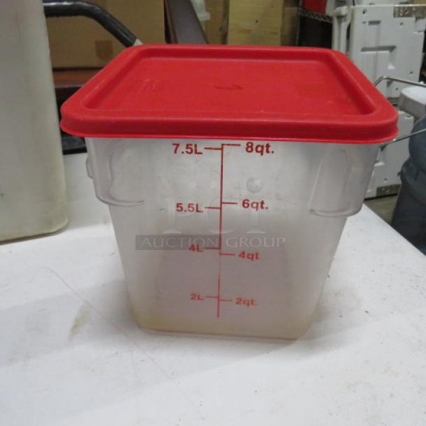 Clear plastic storage container with red lid, 8 qt/7.5 L capacity, marked measurements, used condition.