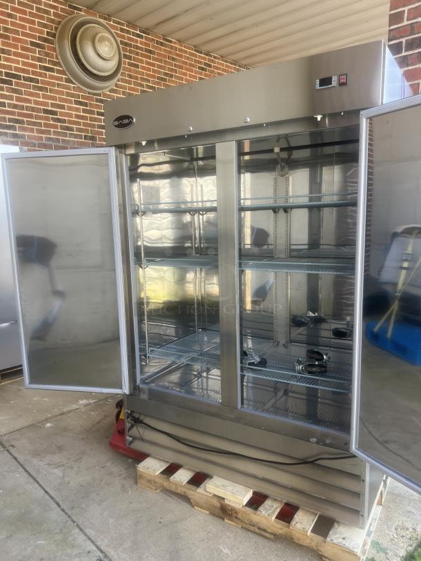 New SABA S-47R stainless steel 2-door refrigerated cooler with castors, open doors, shelves visible, excellent condition.