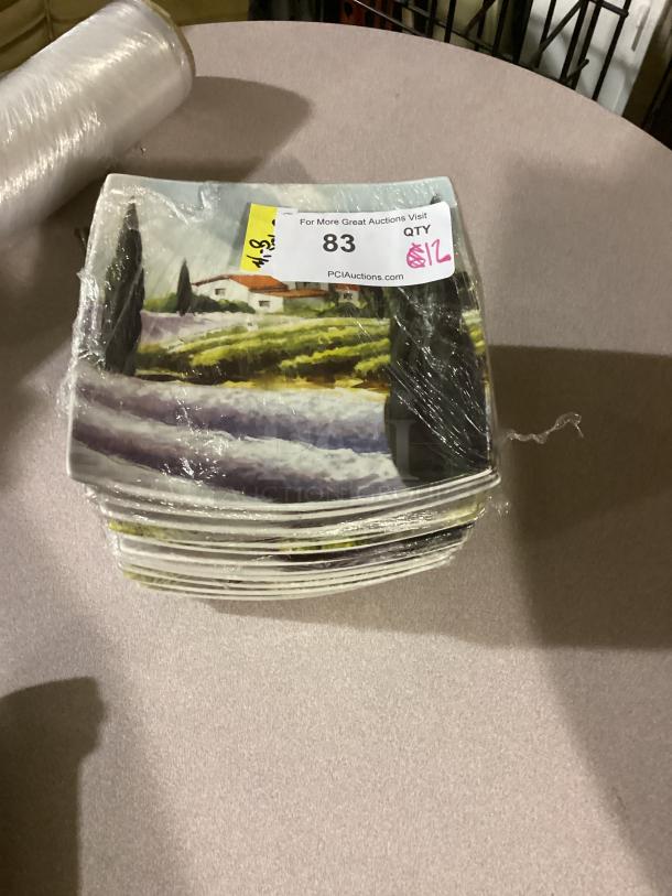 Cypress Home Square Farm Plates, 8-5/8", set of 12, vibrant rural scene, wrapped in plastic, auction tag showing quantity and bid.