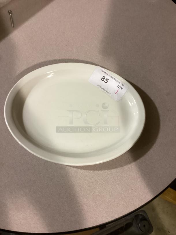Oval white platter, 10-5/8 inches, minimalistic design. Auction number 85. Suitable for serving or decor.