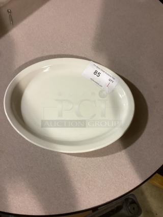 Oval white platter, 10-5/8 inches, minimalistic design. Auction number 85. Suitable for serving or decor.