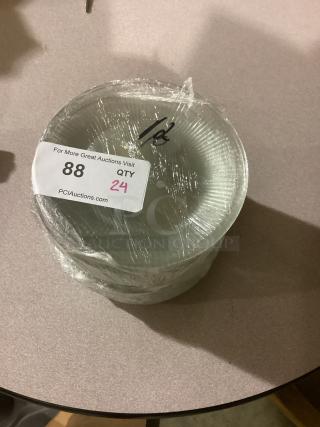 Clear glass plates, 7-1/2 inch, quantity 24, new condition, wrapped in plastic with auction label showing lot number 88.