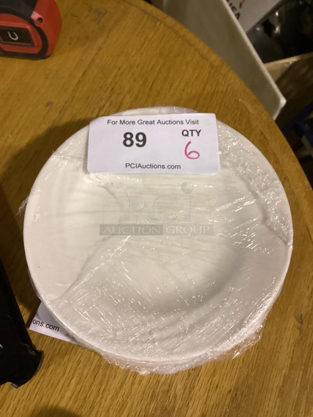 White serving plate, 7-3/4 inches, set of 6, wrapped in plastic. Auction label shows item number 89, quantity 6.