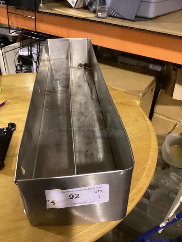 Stainless steel speed rail, 2-1/4"x8-3/4", fair condition, auction tag showing lot 92 and quantity 1.