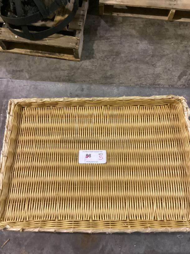 Flat wicker basket, dimensions 26-1/8", in good condition. Includes lot tag with quantity 5 and auction info.