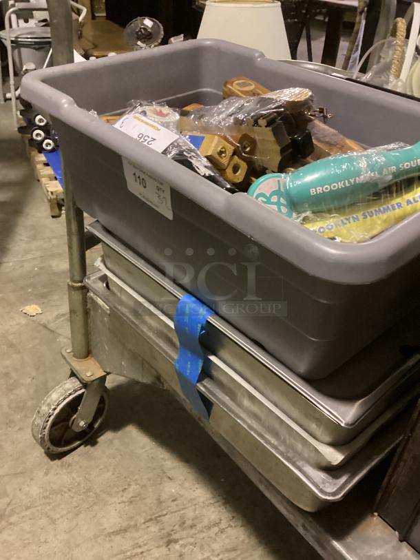 Large beer tap handles in gray bin, quantity 32. Features various styles and designs. Ideal for collectors or bars.