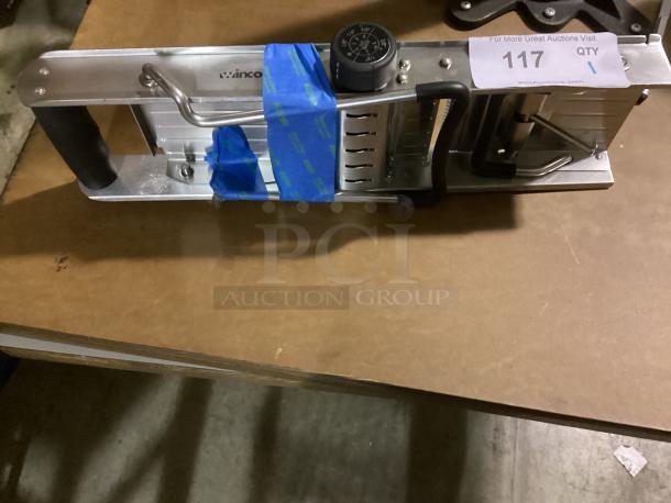 Winco kitchen mandoline slicer, silver, model 17-5/8, with adjustable blade and ergonomic handle. Good condition. Tag number 117.