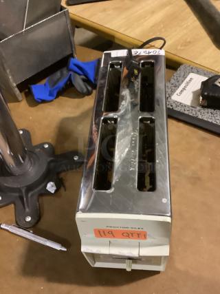 Proctor Silex 4-slice toaster, chrome finish, visible wear, model 14-5/8. Marked with auction tag "119 QTY:1".