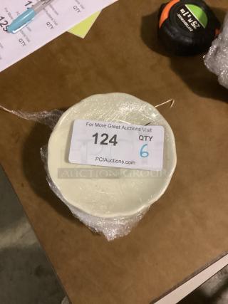Set of 6 small scalloped dessert plates, 5-3/8" diameter, wrapped in plastic. Auction label: "124 QTY 6".