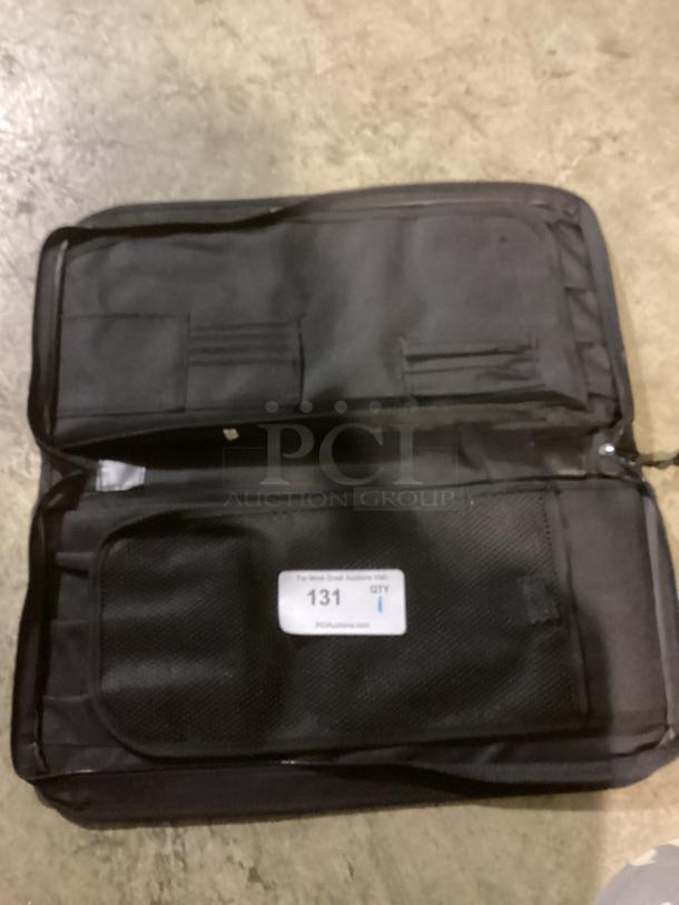 Black multi pocket pouch bag, 20-1/2 inches, features mesh pockets and label tagged "131 QTY" indicating quantity.