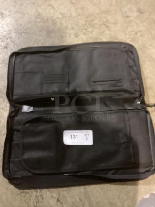 Black multi pocket pouch bag, 20-1/2 inches, features mesh pockets and label tagged "131 QTY" indicating quantity.
