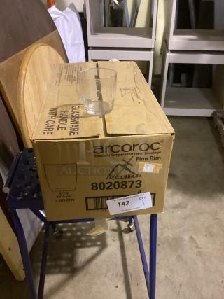 Single small glass cup on top of an Arcoroc box labeled "Glassware Handle with Care," 3.5 oz capacity.