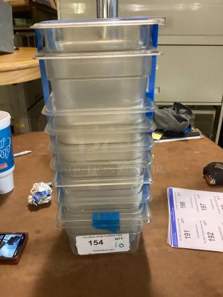 Stack of 10 clear plastic food containers, size 7-7/8, labeled with auction info, quantity tag visible.