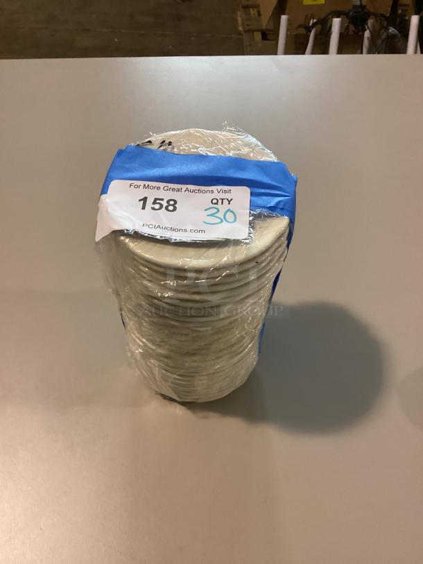 Stack of 30 small scalloped dessert plates, 5-1/2 inches, wrapped in plastic with auction tag, item number 158.