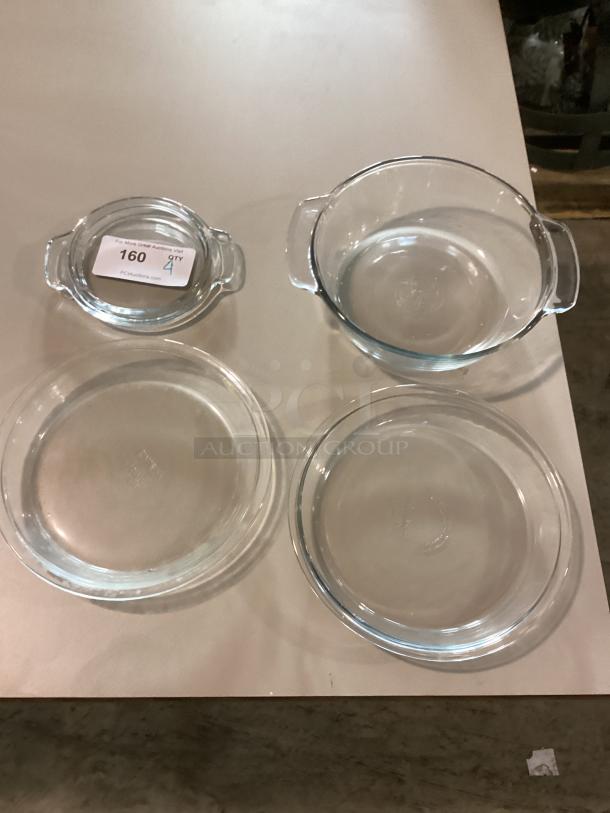 Set of four glass bowls in varied sizes: 11-1/4", 9-7/8", 7-5/8" diameter. Near mint condition. Auction tag shows item number 160.