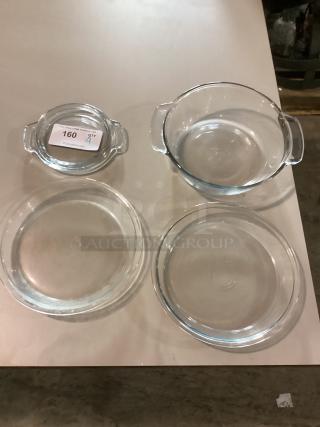Set of four glass bowls in varied sizes: 11-1/4", 9-7/8", 7-5/8" diameter. Near mint condition. Auction tag shows item number 160.