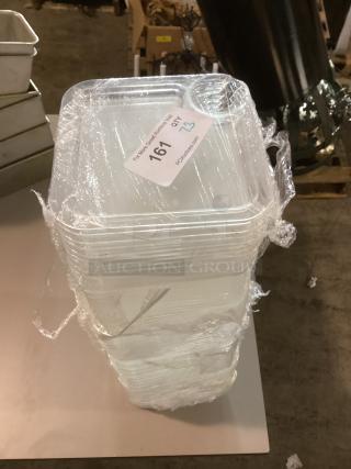 Stack of plastic food trays, 8-1/8 inches, quantity 73, wrapped in plastic. Auction tag indicates Lot 161.