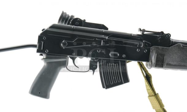 *Credit Card Transaction Only 🪪 - ATF Approved* ⚡️ FFL SHIP ONLY! ⚡️Collectors and firearms enthusiasts, attention!  RARE OPPORTUNITY! Hungarian AMP-69 7.62x39 Rifle! This is a Hungarian AMP-69 Grenade Launching Semi Auto AK type pre-89 rifle with the base being the AMD 63/65 platform built on a FEG SA 85M receiver by FEG / Kassnar Imports Inc. Typically these came in as Post Sample Machine guns by TGI of Tennessee however it is believed that these Semi Auto copies were imported directly by Kassnar before they went out of business in March 1989. All of the marked parts match the original serial number “KP 1801” as seen on the dust cover except for the scope and scope mount. The design was built specifically for grenade launch use with reciprocating forearm and collapsible, spring loaded butt stock, a special gas block with lever for modifying gas volume for grenade or rifle round use, a fully rifled barrel with a special muzzle extension attachment for redirecting gas to propel a grenade round, a special optic mounting rail and low power optic designed for launching grenades up to 400 meters. Must Ship to FFL, Check local laws regarding “Assault Weapons” BEFORE bidding. Pre 1989

Condition: This rifle is in Excellent condition and shows little to no signs of actual use. The bore is a mirror with crisp rifling. The stocks have some very minor marks from handling and the reciprocating components show a bit of finish loss due to standard wear. - Image 3 of 10