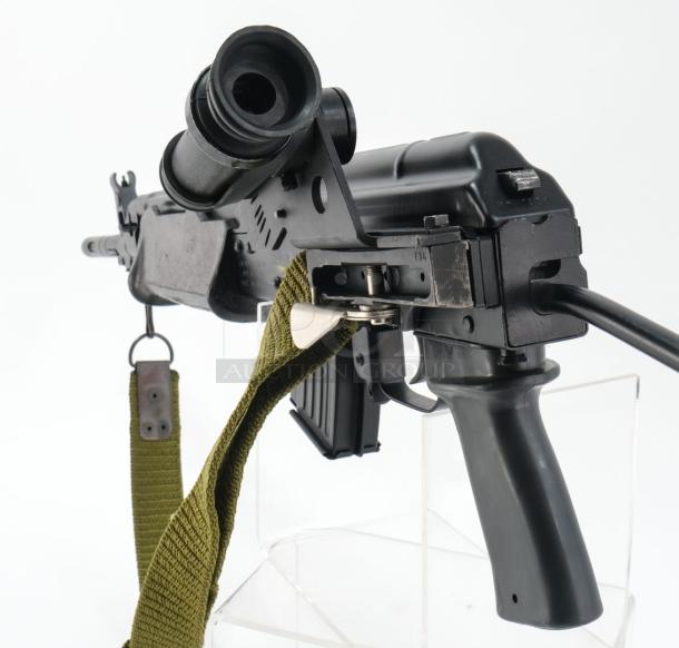 *Credit Card Transaction Only 🪪 - ATF Approved* ⚡️ FFL SHIP ONLY! ⚡️Collectors and firearms enthusiasts, attention!  RARE OPPORTUNITY! Hungarian AMP-69 7.62x39 Rifle! This is a Hungarian AMP-69 Grenade Launching Semi Auto AK type pre-89 rifle with the base being the AMD 63/65 platform built on a FEG SA 85M receiver by FEG / Kassnar Imports Inc. Typically these came in as Post Sample Machine guns by TGI of Tennessee however it is believed that these Semi Auto copies were imported directly by Kassnar before they went out of business in March 1989. All of the marked parts match the original serial number “KP 1801” as seen on the dust cover except for the scope and scope mount. The design was built specifically for grenade launch use with reciprocating forearm and collapsible, spring loaded butt stock, a special gas block with lever for modifying gas volume for grenade or rifle round use, a fully rifled barrel with a special muzzle extension attachment for redirecting gas to propel a grenade round, a special optic mounting rail and low power optic designed for launching grenades up to 400 meters. Must Ship to FFL, Check local laws regarding “Assault Weapons” BEFORE bidding. Pre 1989

Condition: This rifle is in Excellent condition and shows little to no signs of actual use. The bore is a mirror with crisp rifling. The stocks have some very minor marks from handling and the reciprocating components show a bit of finish loss due to standard wear. - Image 6 of 10