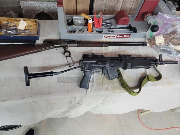 *Credit Card Transaction Only 🪪 - ATF Approved* ⚡️ FFL SHIP ONLY! ⚡️Collectors and firearms enthusiasts, attention!  RARE OPPORTUNITY! Hungarian AMP-69 7.62x39 Rifle! This is a Hungarian AMP-69 Grenade Launching Semi Auto AK type pre-89 rifle with the base being the AMD 63/65 platform built on a FEG SA 85M receiver by FEG / Kassnar Imports Inc. Typically these came in as Post Sample Machine guns by TGI of Tennessee however it is believed that these Semi Auto copies were imported directly by Kassnar before they went out of business in March 1989. All of the marked parts match the original serial number “KP 1801” as seen on the dust cover except for the scope and scope mount. The design was built specifically for grenade launch use with reciprocating forearm and collapsible, spring loaded butt stock, a special gas block with lever for modifying gas volume for grenade or rifle round use, a fully rifled barrel with a special muzzle extension attachment for redirecting gas to propel a grenade round, a special optic mounting rail and low power optic designed for launching grenades up to 400 meters. Must Ship to FFL, Check local laws regarding “Assault Weapons” BEFORE bidding. Pre 1989

Condition: This rifle is in Excellent condition and shows little to no signs of actual use. The bore is a mirror with crisp rifling. The stocks have some very minor marks from handling and the reciprocating components show a bit of finish loss due to standard wear. - Image 9 of 10