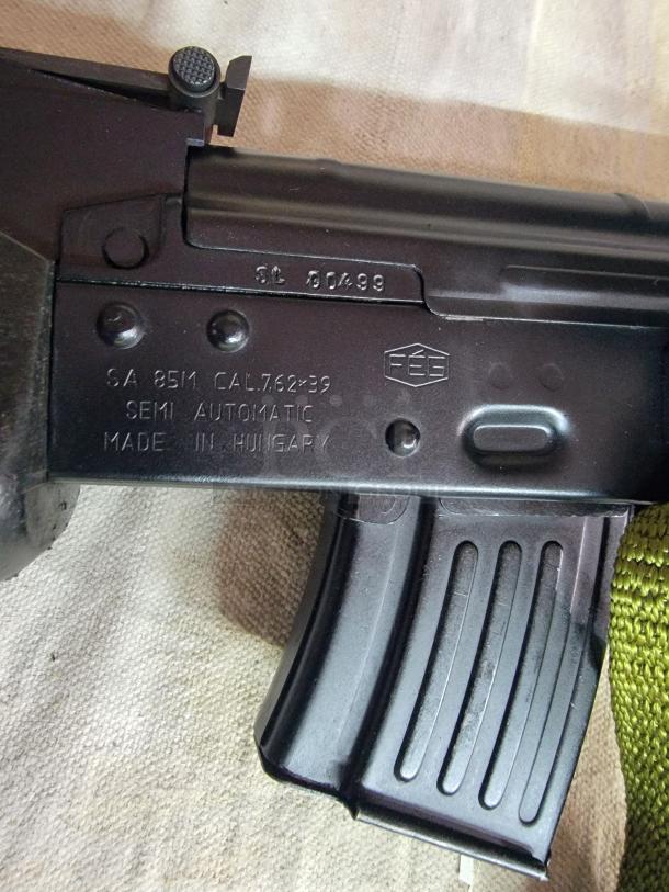 *Credit Card Transaction Only 🪪 - ATF Approved* ⚡️ FFL SHIP ONLY! ⚡️Collectors and firearms enthusiasts, attention!  RARE OPPORTUNITY! Hungarian AMP-69 7.62x39 Rifle! This is a Hungarian AMP-69 Grenade Launching Semi Auto AK type pre-89 rifle with the base being the AMD 63/65 platform built on a FEG SA 85M receiver by FEG / Kassnar Imports Inc. Typically these came in as Post Sample Machine guns by TGI of Tennessee however it is believed that these Semi Auto copies were imported directly by Kassnar before they went out of business in March 1989. All of the marked parts match the original serial number “KP 1801” as seen on the dust cover except for the scope and scope mount. The design was built specifically for grenade launch use with reciprocating forearm and collapsible, spring loaded butt stock, a special gas block with lever for modifying gas volume for grenade or rifle round use, a fully rifled barrel with a special muzzle extension attachment for redirecting gas to propel a grenade round, a special optic mounting rail and low power optic designed for launching grenades up to 400 meters. Must Ship to FFL, Check local laws regarding “Assault Weapons” BEFORE bidding. Pre 1989

Condition: This rifle is in Excellent condition and shows little to no signs of actual use. The bore is a mirror with crisp rifling. The stocks have some very minor marks from handling and the reciprocating components show a bit of finish loss due to standard wear. - Image 10 of 10