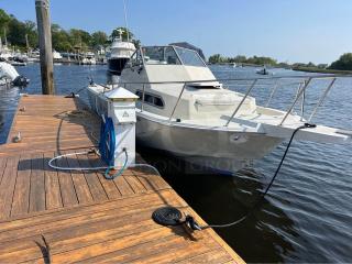 Amazing 1993 27' Boston Whaler Walk-Around Boat! Equipped with Cuddy Cabin, Onboard Restroom and much more! Twin 250HP Yamaha Outboard motors with only 919 hours, Garmin electronic Hook 11, Hummingbird, VHF Radio, etc. This Gem sits on a 2023 Palm Beach 22,500lb Tri-Axle Aluminum Trailer worth $18k alone!