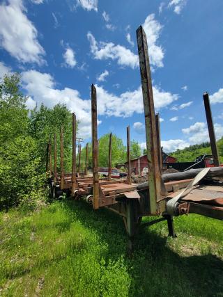 1991 Deloupe Logging WL40 Trailer! Can be used for parts, etc.  The trailer appears to have a sturdy frame with upright stanchions to hold the logs in place during transport.