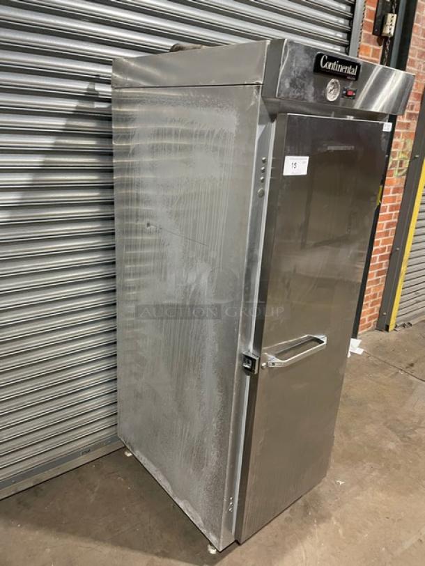 Commercial stainless steel refrigerator by Continental, upright model with a single door. Visible wear, model details unknown.