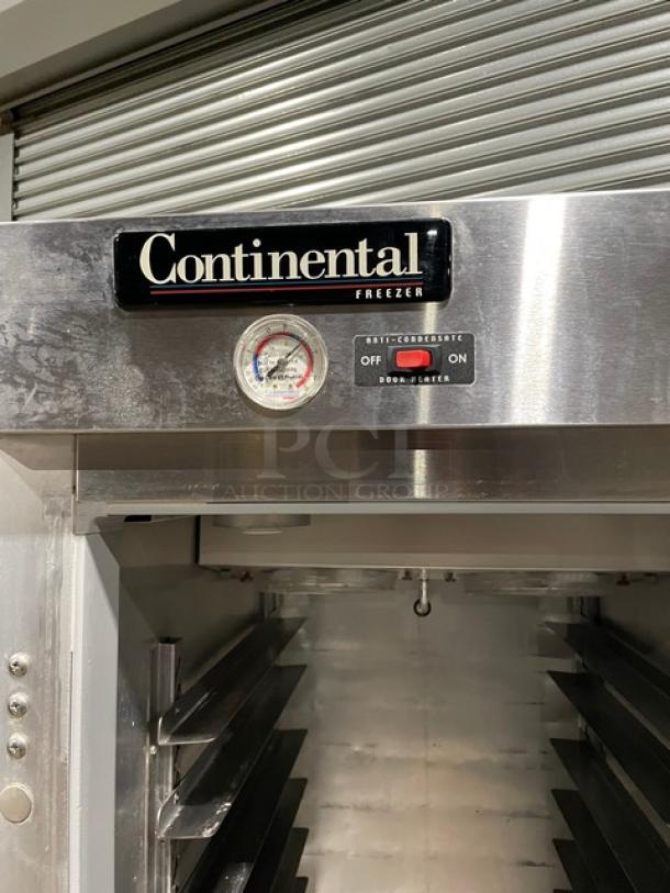 Continental freezer, stainless steel, features a dial thermometer and switches for operating options. Clean interior.
