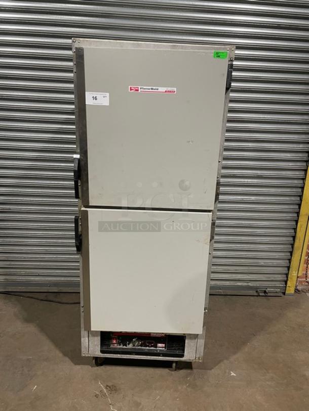Traulsen double-door commercial refrigerator, model TBC, in good condition. Visible Traulsen label and auction number 16 tag.