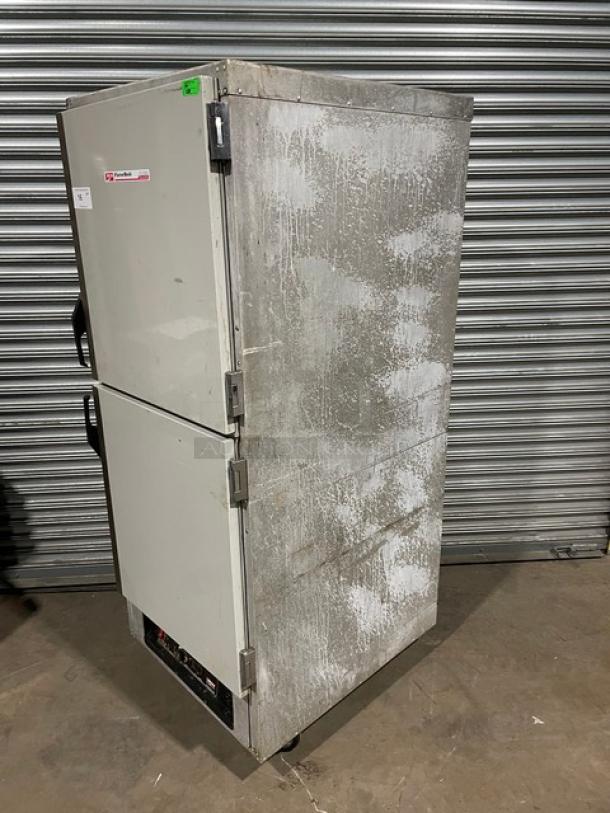 Commercial refrigerator with dual doors, metal exterior, and visible wear. Label shows the make and model. Good for storage.