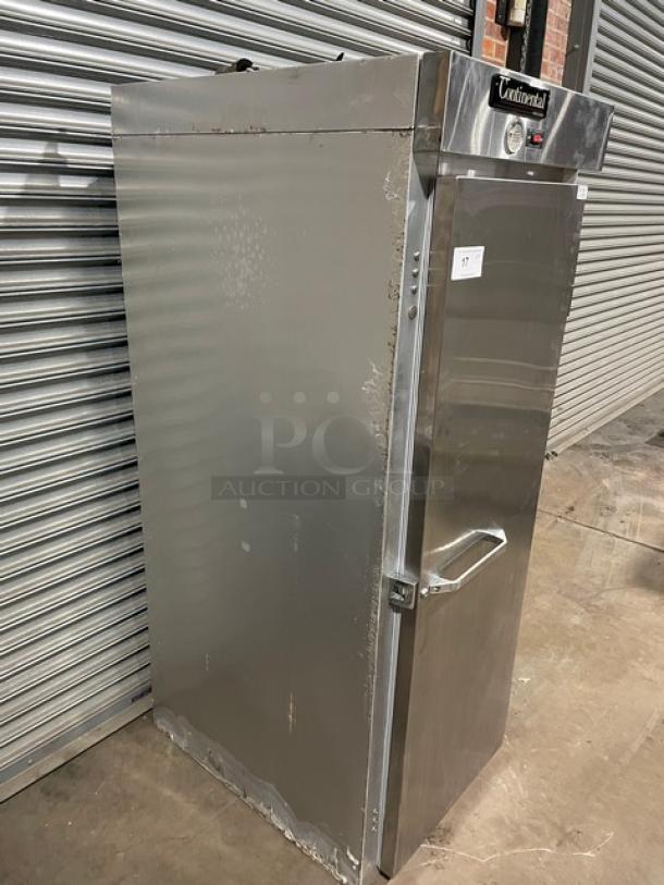 Stainless steel Continental commercial refrigerator, single-door model with visible wear, and manufacturer label on top.
