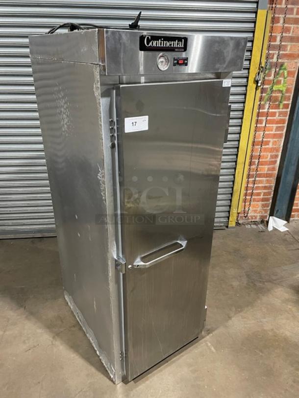 Continental stainless steel commercial refrigerator, single door, top-mounted controls, visible wear, model tag says "17".