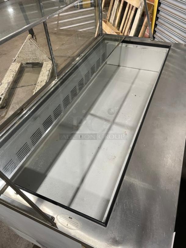 Commercial stainless steel display fridge, glass front, spacious interior, good condition, ideal for deli or bakery use.