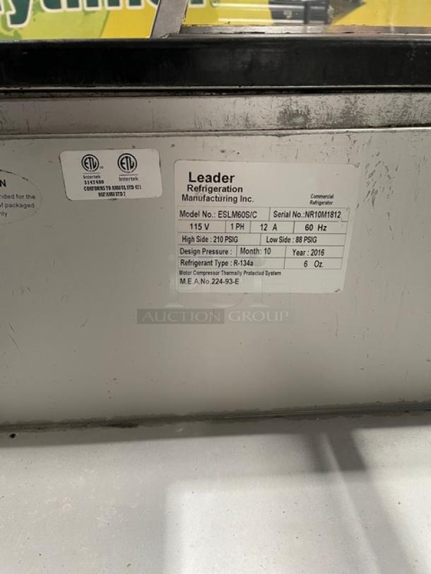 Label on refrigeration unit showing model ESLM69SC, serial NR10M1812, 115V, 12A, 60Hz, refrigerant R-134a, built 2016.