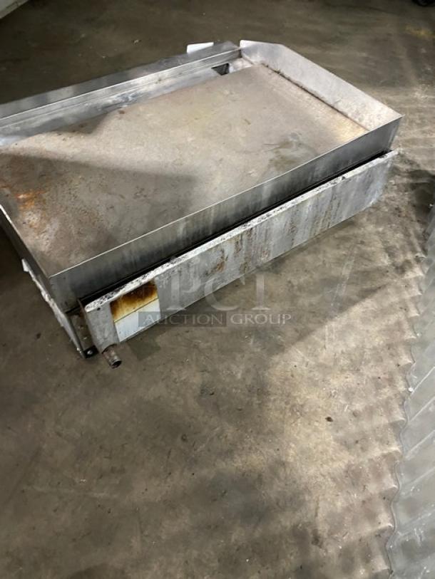 Large rectangular metal tray with rust patches, heavy-duty design, visible wear. Ideal for industrial or commercial use.