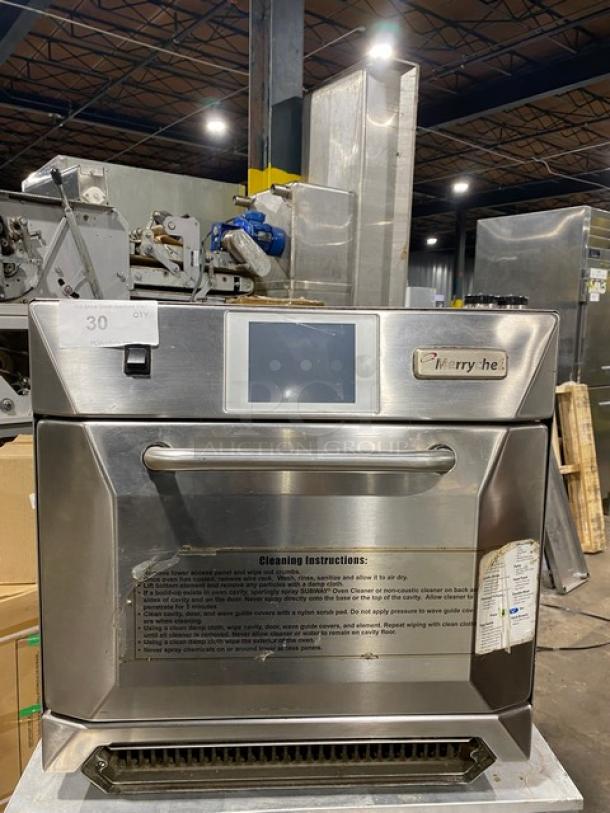 Stainless steel Merrychef commercial oven with digital display, in good condition. Cleaning instructions and label visible.