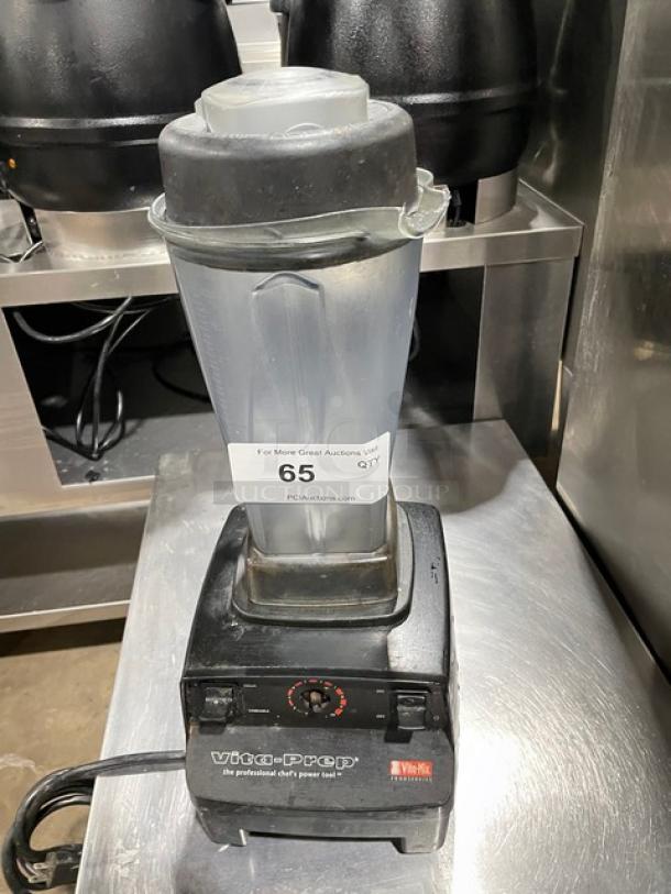 Vita-Prep blender with plastic pitcher and black base, model marked as Vita-Mix, in used condition. Auction tag 65 visible.