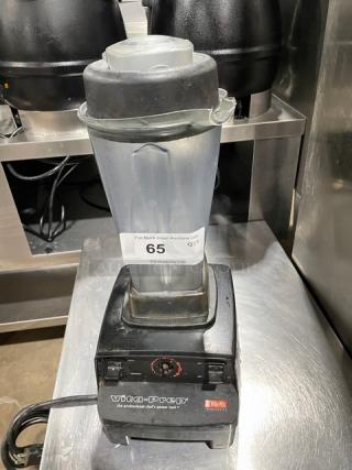Vita-Prep blender with plastic pitcher and black base, model marked as Vita-Mix, in used condition. Auction tag 65 visible.