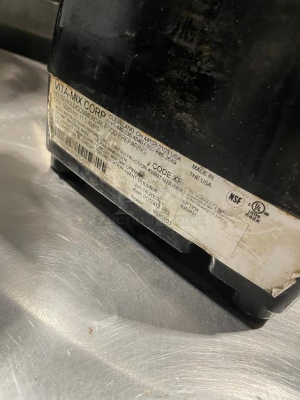 Vita-Mix Corp food preparation machine, commercial model VM0103, made in USA. Visible wear, label with specifications.