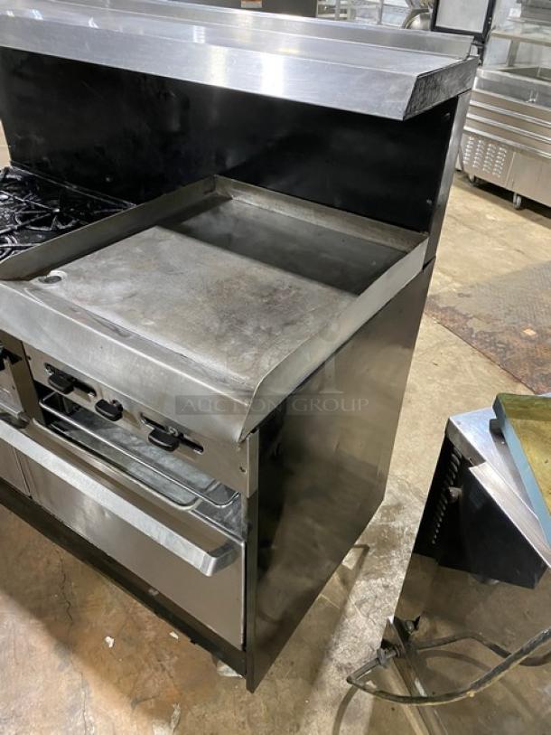 Garland Commercial Stainless Steel Natural Gas Powered 6 Burner Range/Raised Flat Griddle Split Top & Double Oven Combo! With Built-In Broiler/Cheese Melter! With Back Splash & Overhead Salamander Shelf! With Wired Oven Racks! On Casters! - Image 2 of 10