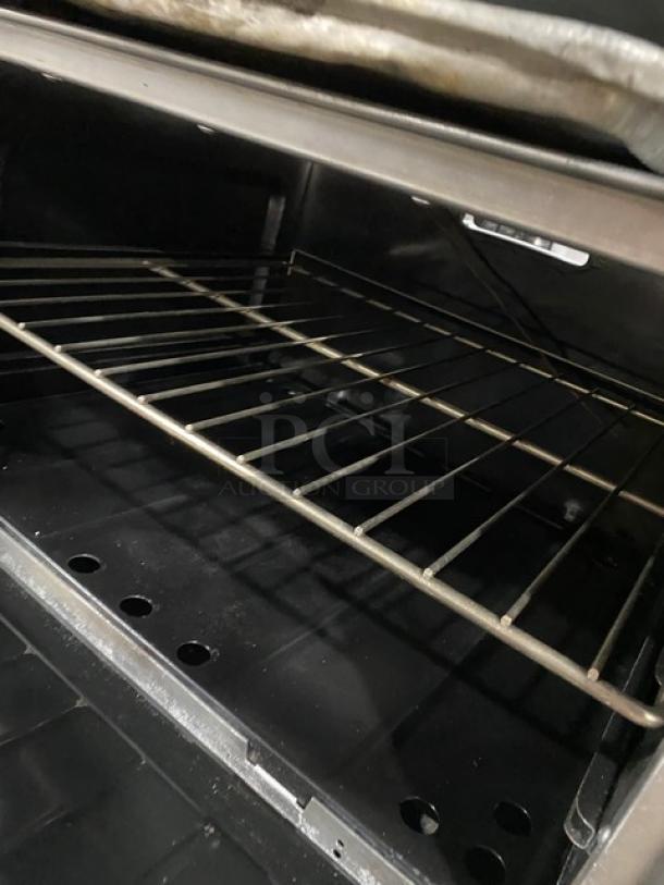 Garland Commercial Stainless Steel Natural Gas Powered 6 Burner Range/Raised Flat Griddle Split Top & Double Oven Combo! With Built-In Broiler/Cheese Melter! With Back Splash & Overhead Salamander Shelf! With Wired Oven Racks! On Casters! - Image 9 of 10