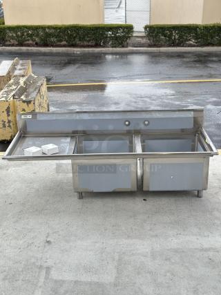 BRAND NEW! SCRATCH AND DENT! Regency - 16 Gauge Stainless Steel Two Compartment Sink with Left Drainboard.