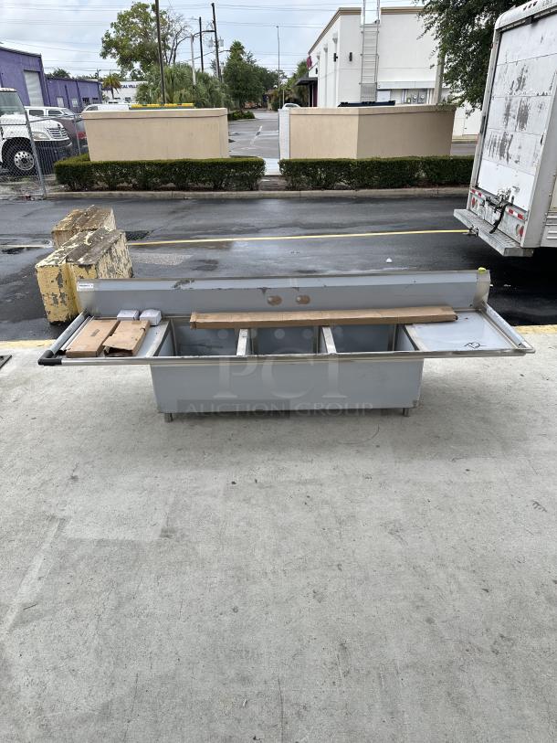 BRAND NEW! SCRATCH AND DENT! Regency - 16-Gauge Stainless Steel Three Compartment Commercial Sink with Galvanized Steel Legs and 2 Drainboards - 23" x 23" x 12" Bowls - Image 1 of 4